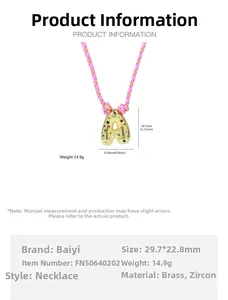 Detailed view of bubble letter A pendant in gold brass with colorful cubic zirconia