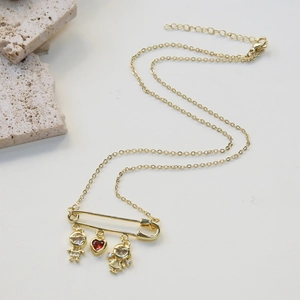 Collana a spilla dorata con pietra portafortuna a cuore e ciondoli bimbo bimba