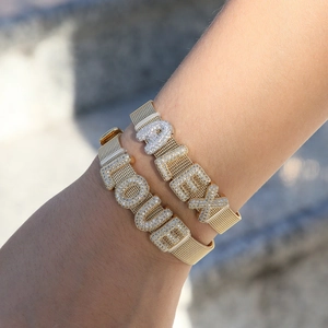 Custom gold mesh bracelet with sparkling cubic zirconia alphabet letters ALEX and LOUIE