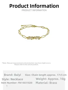 Macro shot of gold-plated brass MOM paperclip necklace with zircon heart charm