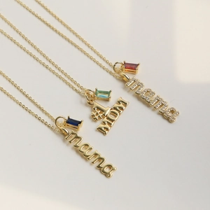 Three gold MAMA and #1 MOM necklaces with birthstone pendants in blue, green, and red