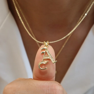 18k gold plated letter A pendant necklace with micro-paved zircons on a delicate chain