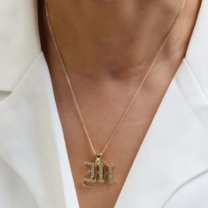 18k gold plated gothic letter A pendant necklace with micro-pave cubic zirconia on model