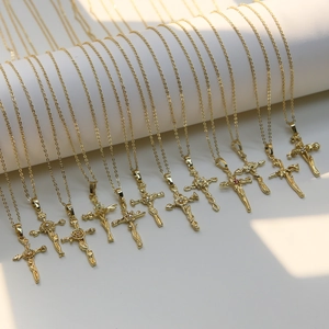 18k gold plated brass cross pendant necklace featuring delicate monthly flower engravings
