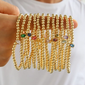 Ελαστικά βραχιόλια με χρυσές χάντρες 18k και πολύχρωμα ζιργκόν σε σχήμα δάκρυ