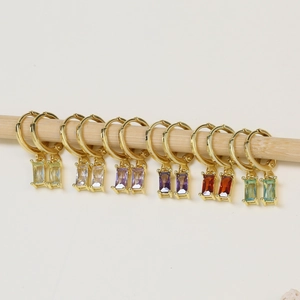 Elegant gold hoop earrings featuring rectangular birthstones in six vibrant colors