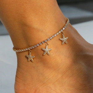 Elegant gold starfish anklet with paved zircon crystals for beach and summer vacations