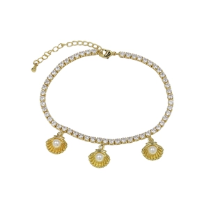 Detail of gold starfish shell anklet with sparkling zircons and white pearl charms
