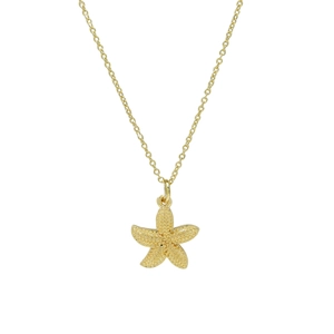 Detail of a golden starfish pendant showing intricate beaded texture and polished gold finish