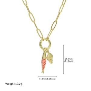Detail of paperclip chain necklace with pink enamel fish and gold shell charms