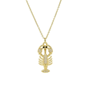 Detailed close-up of a gold lobster pendant necklace featuring white cubic zirconia accents