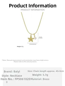 Detailed view of gold starfish pendant with white pearl and brass chain dimensions