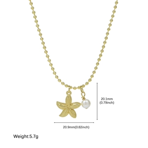 Gold beaded necklace featuring a textured starfish charm and white pearl pendant