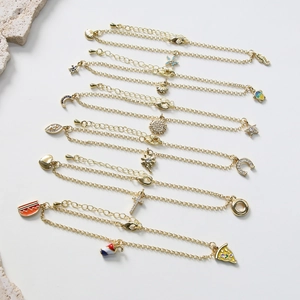 Detailed set of seven gold-tone anklets featuring sea shells, stars and heart charms