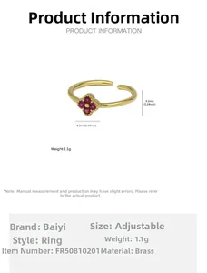 Close-up of gold-plated daisy flower ring with red zircons and measurement details