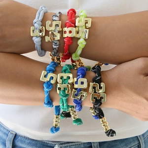 Colorful woven paracord lucky number bracelets with gold charms and adjustable knots
