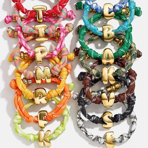 Customized colorful nylon braided rope bracelets with gold metal lucky numbers and letters