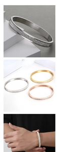 Detailed macro view showing three colors of sparkling zircon inlaid titanium steel bangles