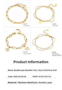 Detalle de pulseras de doble capa en acero de titanio con caritas y estrellas de suerte