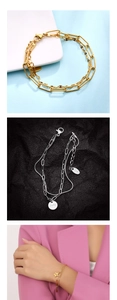 Detalle de pulsera de doble capa en acero inoxidable con colgante de estrella Lucky