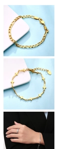 Detailed view of 18K gold Figaro chain and hollow cross bracelets in elegant design