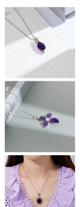 Detailed close-up of three vintage purple crystal necklaces with floral pendant designs