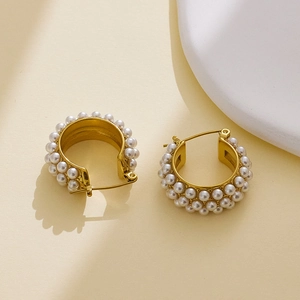 Close-up of elegant 18k gold plated C-shaped earrings with multiple rows of white pearls