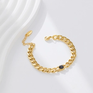 Detail of 18k gold plated stainless steel Cuban chain with black gemstone and lobster clasp