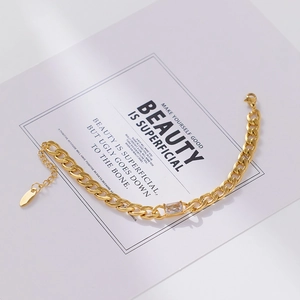 Detail of 18k gold plated cuban chain bracelet featuring a square zircon stone inlay