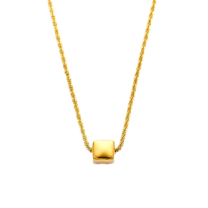 Minimalist gold necklace with a polished cube pendant and twisted rope chain texture