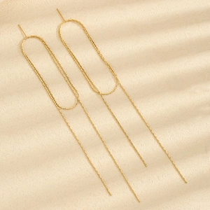 Golden multi-layer tassel threader earrings with geometric U-shaped frame and long chains