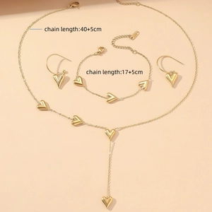 Elegant gold heart jewelry set featuring Y-shaped necklace and matching bracelet