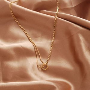 Minimalist gold geometric circle necklace with combined bead and box chain on silk
