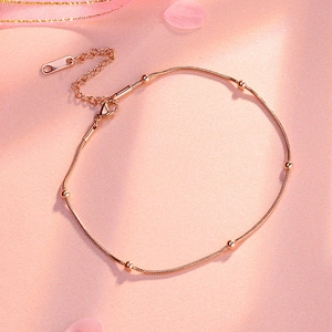 Rose gold stainless steel beaded anklet with sleek snake chain and lobster clasp