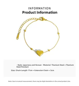 Detail of gold titanium heart bracelet with lobster clasp and adjustable extension chain