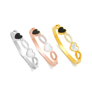 Set of three stainless steel heart bangles in gold, rose gold and silver with zircon