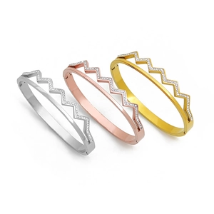 Three wave diamond stainless steel bangles in gold, silver, and rose gold colors