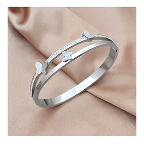 Detail of silver double-layered butterfly bracelet with sparkling zircon stones on silk