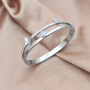 Double-layered titanium steel butterfly bracelet with pave diamond inlay and matte finish