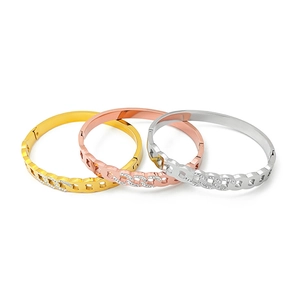 Three-piece Cuban link twist bangles in gold, rose gold and silver with zircon accents