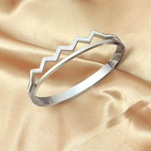 Silver double-layer titanium steel wave bracelet with diamonds on gold silk background