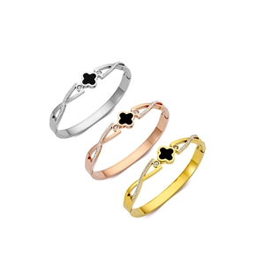 Sparkling four-leaf clover open bangles in silver, gold, and rose gold with zircon stones