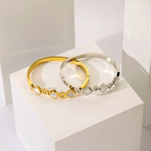 Elegant 18K gold plated stainless steel geometric bangle with white shell and diamonds