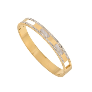 Bracelet en acier titane doré orné de zircons brillants et incrustations de nacre blanche