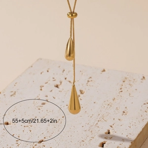 Luxurious gold teardrop tassel necklace and earrings set with high-polish finish