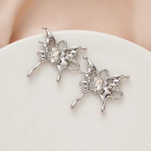 Detail of silver liquid metal butterfly pendants with center sparkling marquise crystal