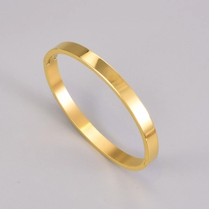Polished gold titanium steel minimalist bangle with hidden side hinge closure