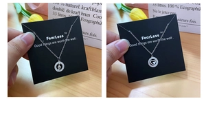 Detail of silver heart and musical note pendants with crystal pavé on slim chains
