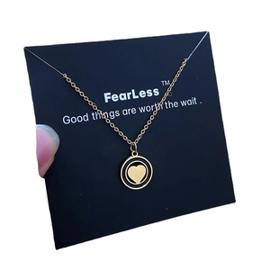 Luxurious gold heart pendant necklace with black outer ring and fine stainless steel chain