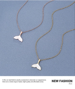 Detail of 18k gold plated fish tail necklaces in rose gold and yellow gold finishes